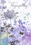 This sympathy card presents a tender visual poem, one that seems to echo the gentle pace of Rayners Lane in its quieter moments. From the lower edge, fine, reed-like stems emerge, each one carrying a delicate, umbrella-shaped cluster of wildflowers. These lacey umbels are drawn with soft precision, composed of tiny florets that feel almost like whispers on the page. Their colours are cool and calming - veils of lavender, muted indigo, and pale blue-grey, deepened in places by touches of silver-green that suggest foliage or distant grass. The background is a seamless watercolour blend, where lavender melts into soft blue and then into a light, misty grey, like a sky just clearing after rain along Alexandra Avenue. Across this gentle field of colour, pale impressions of additional stems and leaves drift in and out of focus, adding depth without disturbing the serenity. A few butterflies, rendered with translucent wings and subtle outlines, float among the blooms, symbolising transformation, ongoing connection, and the lingering presence of cherished memories. There is an embracing stillness here, the kind we aim to capture in simple, elegant funeral tributes arranged for families across Rayners Lane. The card does not crowd the senses; instead, it invites a pause, a moment of quiet contemplation amid grief. Its cool yet comforting palette and restrained design create a respectful space for emotion, making it a thoughtful companion to sympathy flowers delivered locally - a way to convey sincere condolences through gentle imagery, when spoken words may feel too small.
